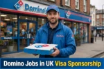 Domino Jobs in UK with Visa Sponsorship delivery driver holding pizza box in front of Domino's store